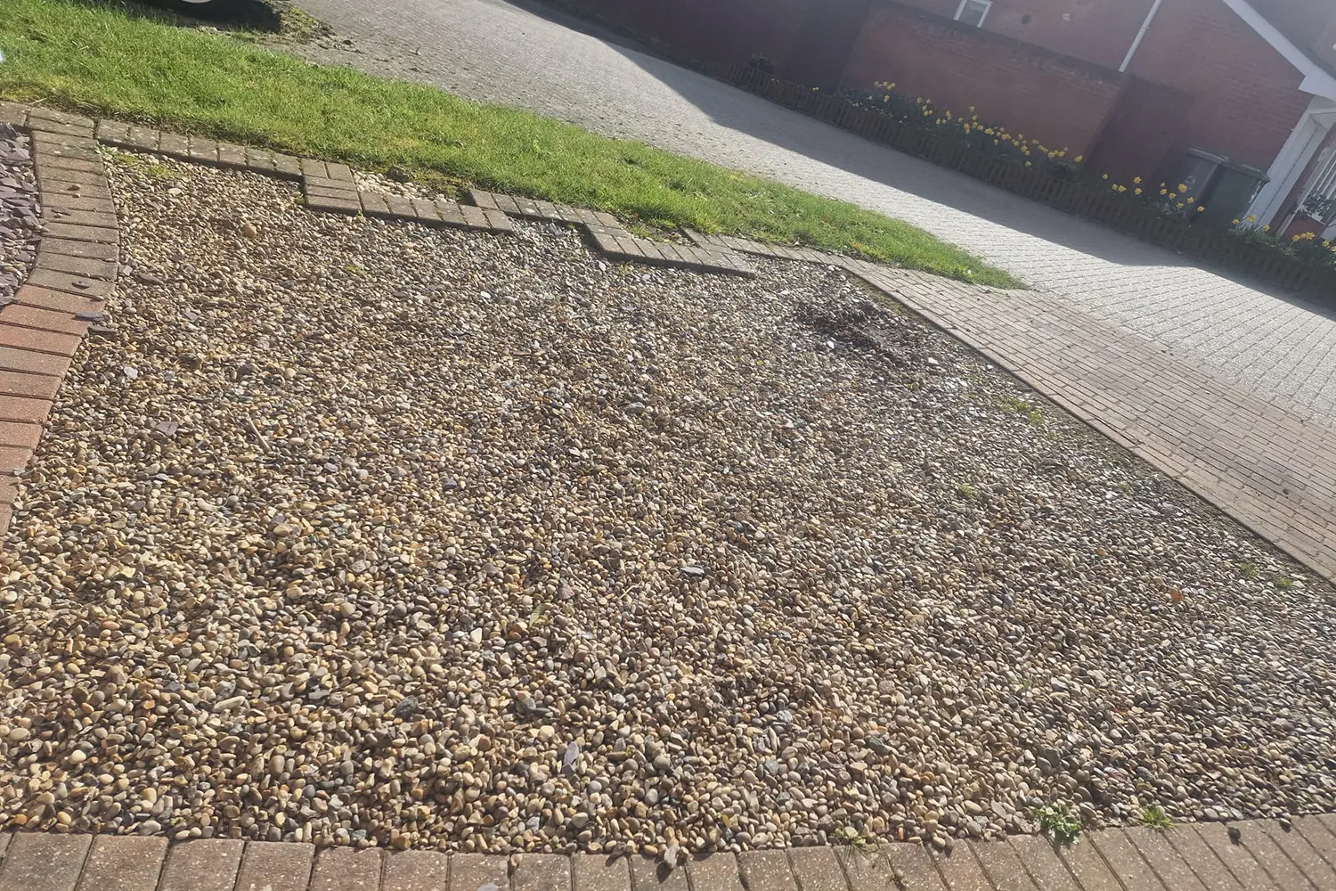 loose gravel parking area before resin resurfacing dussindale